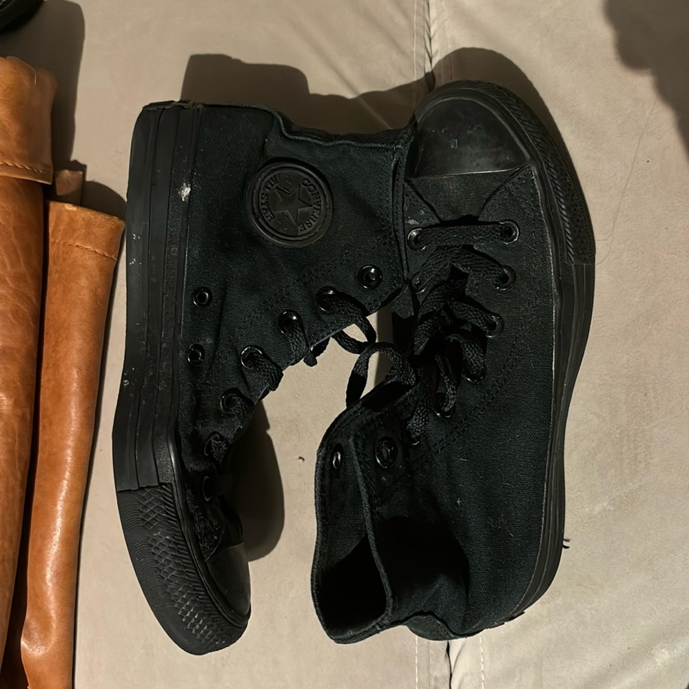 All black high-top Converse